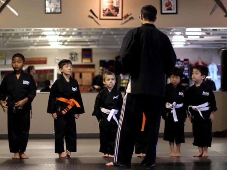 kids taught by a martial arts instructor
