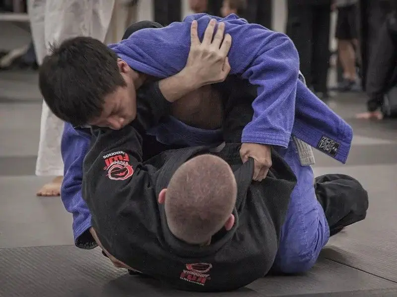 students doing drills for jiu jitsu lessons