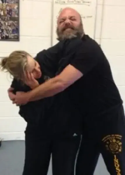 students practicing self defense lessons